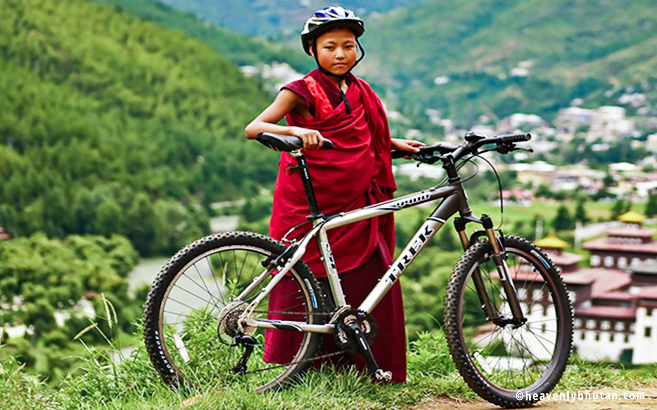 Travel-Bhutan-on-Bike-Little-Monk-on-Cycle