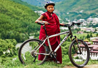 Travel-Bhutan-on-Bike-Little-Monk-on-Cycle